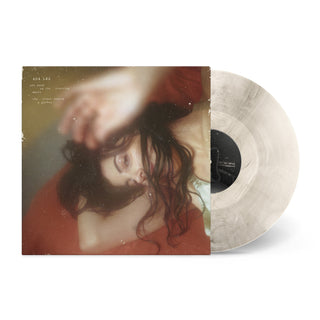 one hand on the steering wheel the other sewing a garden