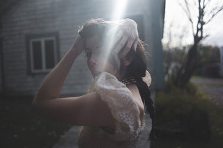 Ada Lea - one hand on the steering wheel the other sewing a garden