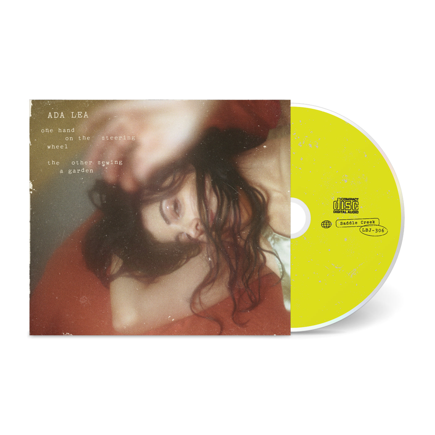 one hand on the steering wheel the other sewing a garden